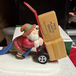Department 56 North Pole Series Snow Delivery with Red and White Accents